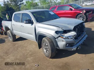 2021 Toyota Tacoma SR z VIN 3TMCZ5AN7MM373405, wystawiony jako IAAI lot #42155410 z przebiegiem 131 231 mil mil oraz . Historia ofert i sprzedaży dostępna na DreamBid. Obrazek 1.