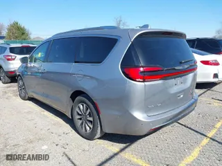 2021 Chrysler Pacifica Hybrid Touring L with VIN 2C4RC1L77MR594630, listed as a IAAI auction lot 41739229 with 79,556 mi miles. Bid and sale history available at carsss.com. Image 3.