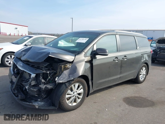 2017 Kia Sedona LX with VIN KNDMB5C19H6329933, listed as a IAAI auction lot 41796158 with 101,399 mi miles. Bid and sale history available at carsss.com. Image 2.