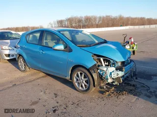 2015 Toyota Prius c One with VIN JTDKDTB37F1086741, listed as a IAAI auction lot 41642663 with 121,313 mi miles. Bid and sale history available at carsss.com. Image 1.