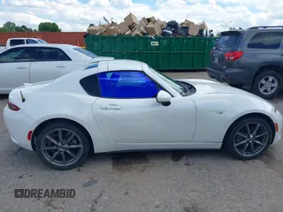 2020 Mazda MX-5 Miata Grand Touring z VIN JM1NDAM79L0411456, wystawiony jako IAAI lot #42229479 z przebiegiem 63 508 mil mil oraz . Historia ofert i sprzedaży dostępna na DreamBid. Obrazek 13.