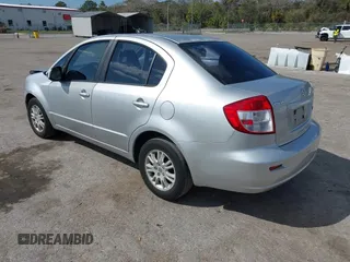 2012 Suzuki SX4 LE with VIN JS2YC5A30C6304324, listed as a IAAI auction lot 41585174 with 111,471 mi miles. Bid and sale history available at carsss.com. Image 3.