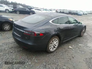 2016 Tesla Model S 70 with VIN 5YJSA1E13GF174542, listed as a IAAI auction lot 41169279 with 72,691 mi miles and . Bid and sale history available at DreamBid. Image 4.