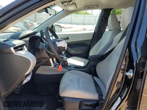 2023 Toyota Corolla Cross LE with VIN 7MUCAAAG3PV058094, listed as a Copart auction lot 57983105 with 30,593 mi miles and Salvage title. Bid and sale history available at DreamBid. Image 7.
