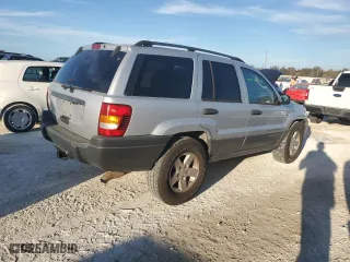 2004 Jeep Grand Cherokee Laredo with VIN 1J4GX48N74C406647, listed as a Copart auction lot 77631654 with 174,824 mi miles and Salvage Title. Bid and sale history available at carsss.com. Image 3.