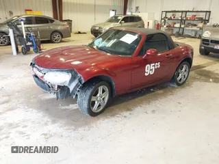 2007 Mazda MX-5 Miata Sport z VIN JM1NC25F970132299, wystawiony jako IAAI lot #41622791 z przebiegiem 72 392 mil mil oraz . Historia ofert i sprzedaży dostępna na DreamBid. Obrazek 18.