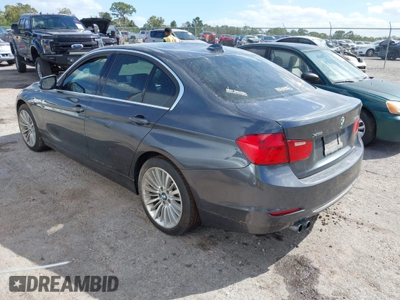 2013 BMW 3 Series 328i xDrive with VIN WBA3B3G56DNR81144, listed as a IAAI auction lot 40620694 with 159,022 mi miles. Bid and sale history available at carsss.com. Image 3.