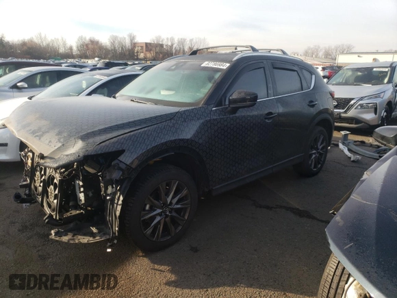 2021 Mazda CX-5 Signature with VIN JM3KFBEY2M0345187, listed as a Copart auction lot 82786984 with 98,014 mi miles and Salvage Title. Bid and sale history available at carsss.com. Image 1.
