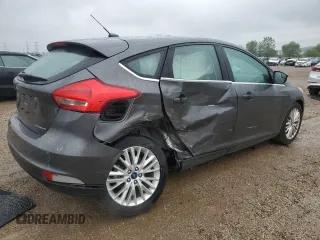 2018 Ford Focus Titanium z VIN 1FADP3N21JL295883, wystawiony jako Copart lot #59051015 z przebiegiem 43 284 mil mil oraz Szkoda całkowita • Salvage title. Historia ofert i sprzedaży dostępna na DreamBid. Obrazek 3.