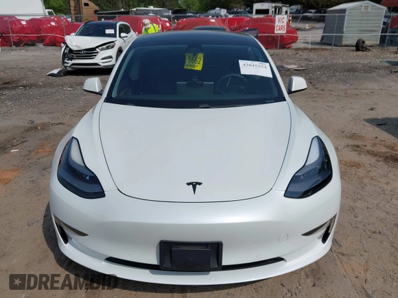 2021 Tesla Model 3 Standard Range Plus z VIN 5YJ3E1EA9MF027985, wystawiony jako IAAI lot #42045254 z przebiegiem 42 353 mil mil oraz . Historia ofert i sprzedaży dostępna na DreamBid. Obrazek 12.