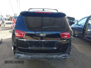 2021 Kia Sedona EX with VIN KNDMC5C10M6671729, listed as a IAAI auction lot 40858206 with 58,775 mi miles. Bid and sale history available at carsss.com. Image 17.