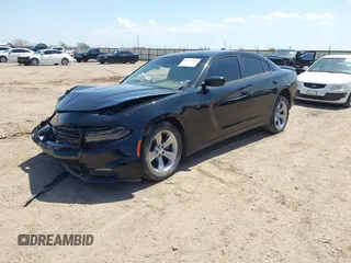 2017 Dodge Charger SXT with VIN 2C3CDXHG0HH571849, listed as a IAAI auction lot 42012518 with 104,586 mi miles and . Bid and sale history available at carsss.com. Image 2.