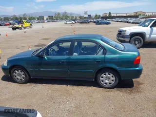1999 Honda Civic VP with VIN 2HGEJ6611XH540017, listed as a IAAI auction lot 42093222 with 154,261 mi miles. Bid and sale history available at carsss.com. Image 14.