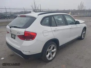 2013 BMW X1 xDrive35i with VIN WBAVM5C53DVV89288, listed as a IAAI auction lot 41609285 with 114,659 mi miles. Bid and sale history available at carsss.com. Image 4.