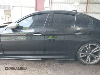 2018 BMW 5 Series M550i xDrive with VIN WBAJB9C51JB035949, listed as a IAAI auction lot 42085727 with Not provided miles and . Bid and sale history available at DreamBid. Image 13.