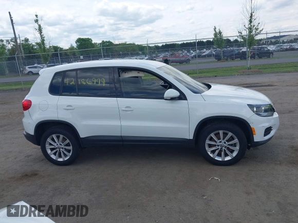 2014 Volkswagen Tiguan S with VIN WVGBV3AX0EW589381, listed as a IAAI auction lot 42186999 with 144,137 mi miles and . Bid and sale history available at DreamBid. Image 13.