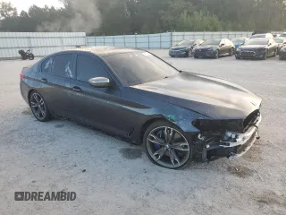 2019 BMW 5 Series M550i xDrive with VIN WBAJB9C57KB288906, listed as a Copart auction lot 79846274 with 61,744 mi miles and Salvage title. Bid and sale history available at DreamBid. Image 4.