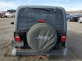 2002 Jeep Wrangler Sport with VIN 1J4FA49S32P758082, listed as a Copart auction lot 80692073 with 148,784 mi miles and Salvage Title. Bid and sale history available at carsss.com. Image 6.