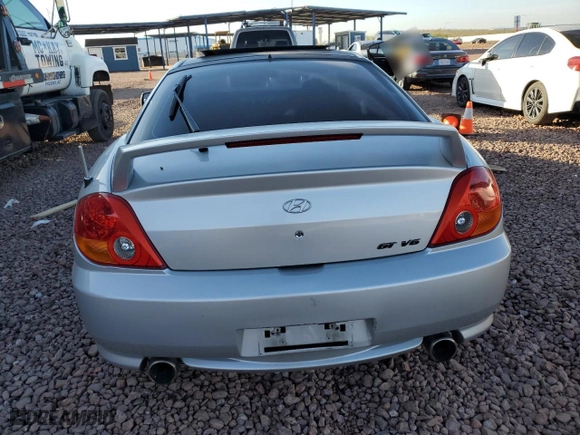 2004 Hyundai Tiburon GT with VIN KMHHN65F44U130202, listed as a Copart auction lot 43193404 with 207,694 mi miles and Salvage Title. Bid and sale history available at carsss.com. Image 6.