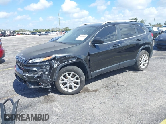 2015 Jeep Cherokee Latitude with VIN 1C4PJLCB4FW683904, listed as a IAAI auction lot 41579059 with 126,156 mi miles and . Bid and sale history available at carsss.com. Image 2.