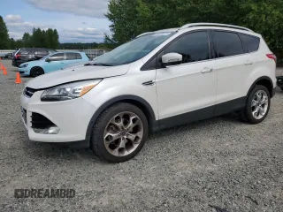2015 Ford Escape Titanium with VIN 1FMCU9J96FUC15477, listed as a Copart auction lot 62529675 with 85,069 mi miles and Salvage title. Bid and sale history available at DreamBid. Image 1.