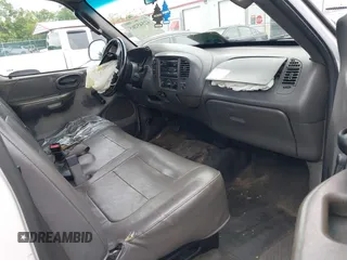 2004 Ford F-150 XL with VIN 2FTRF17204CA52584, listed as a IAAI auction lot 42545265 with 142,072 mi miles and . Bid and sale history available at DreamBid. Image 5.