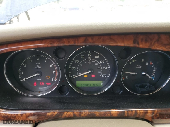 2004 Jaguar XJ with VIN SAJWA71C34SG19800, listed as a Copart auction lot 71877194 with 157,051 mi miles and Salvage Title. Bid and sale history available at carsss.com. Image 9.