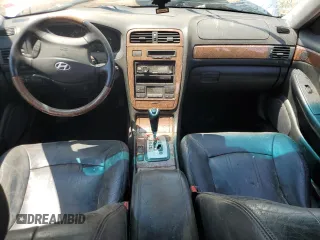 2004 Hyundai XG z VIN KMHFU45E64A320817, wystawiony jako Copart lot #58951955 z przebiegiem 179 978 mil mil oraz Nie do naprawy • Non repairable. Historia ofert i sprzedaży dostępna na DreamBid. Obrazek 8.