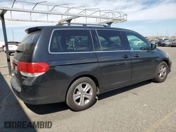 2010 Honda Odyssey Touring with VIN 5FNRL3H9XAB067890, listed as a Copart auction lot 63520575 with 213,582 mi miles and Clean title. Bid and sale history available at DreamBid. Image 3.