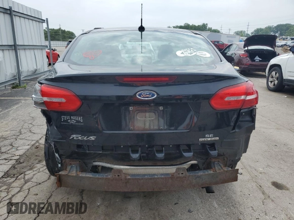 2016 Ford Focus SE z VIN 1FADP3F21GL262289, wystawiony jako Copart lot #60318515 z przebiegiem 79 529 mil mil oraz Szkoda całkowita • Salvage title. Historia ofert i sprzedaży dostępna na DreamBid. Obrazek 6.