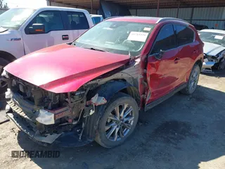 2020 Mazda CX-5 Grand Touring with VIN JM3KFADM3L0761286, listed as a IAAI auction lot 41715379 with 145,656 mi miles and . Bid and sale history available at DreamBid. Image 18.