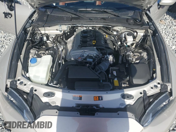 2023 Mazda MX-5 Miata Grand Touring z VIN JM1NDAM70P0551336, wystawiony jako Copart lot #54984385 z przebiegiem 10 948 mil mil oraz Szkoda całkowita • Salvage title. Historia ofert i sprzedaży dostępna na DreamBid. Obrazek 11.