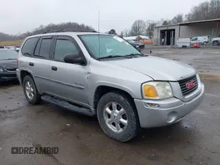 2006 GMC Envoy SLE with VIN 1GKDT13S562187698, listed as a IAAI auction lot 41808778 with 167,023 mi miles. Bid and sale history available at carsss.com. Image 1.