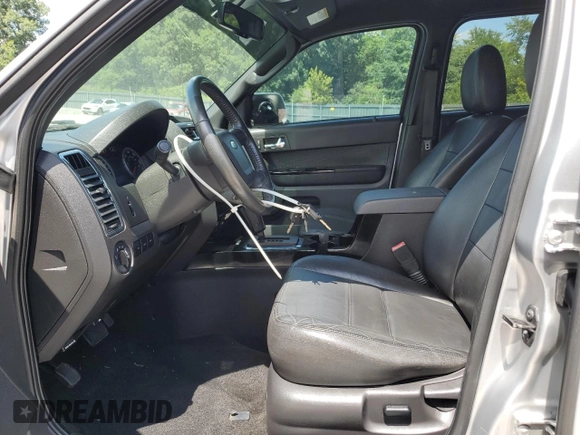 2010 Ford Escape Limited with VIN 1FMCU0E77AKC58458, listed as a Copart auction lot 64207645 with 160,650 mi miles and Salvage title. Bid and sale history available at DreamBid. Image 7.
