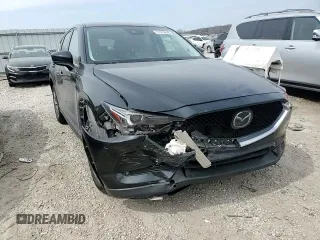 2021 Mazda CX-5 Grand Touring with VIN JM3KFBDM6M0401517, listed as a Copart auction lot 51019645 with 55,906 mi miles and Salvage Title. Bid and sale history available at DreamBid. Image 11.