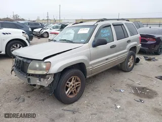 2004 Jeep Grand Cherokee Laredo with VIN 1J4GX48S44C301120, listed as a IAAI auction lot 41281556 with 267,246 mi miles. Bid and sale history available at carsss.com. Image 18.