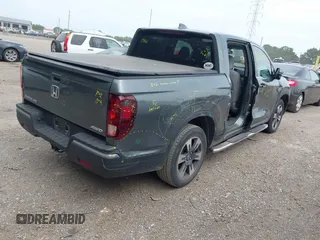 2018 Honda Ridgeline RTL-T with VIN 5FPYK3F61JB013733, listed as a IAAI auction lot 42548122 with 92,407 mi miles and . Bid and sale history available at DreamBid. Image 4.