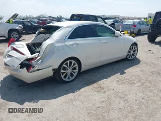 2013 Cadillac ATS Premium z VIN 1G6AE5S35D0129175, wystawiony jako IAAI lot #42037872 z przebiegiem 95 747 mil mil oraz . Historia ofert i sprzedaży dostępna na DreamBid. Obrazek 4.
