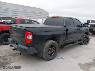 2014 Toyota Tundra 4WD Truck SR with VIN 5TFUM5F14EX051843, listed as a IAAI auction lot 41773983 with 145,089 mi miles. Bid and sale history available at carsss.com. Image 4.