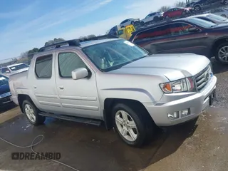 2014 Honda Ridgeline RTL z VIN 5FPYK1F51EB012843, wystawiony jako IAAI lot #41629002 z przebiegiem 114 761 mil mil oraz . Historia ofert i sprzedaży dostępna na DreamBid. Obrazek 13.