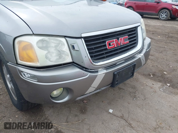 2005 GMC Envoy SLT with VIN 1GKDT13S352129944, listed as a IAAI auction lot 41527180 with 188,541 mi miles. Bid and sale history available at carsss.com. Image 12.