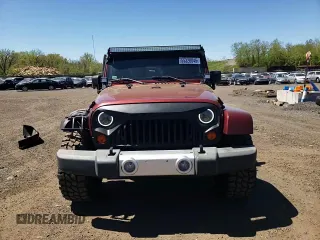 2008 Jeep Wrangler Sahara z VIN 1J4FA54198L505014, wystawiony jako Copart lot #55328045 z przebiegiem 128 049 mil mil oraz Szkoda całkowita • Salvage title. Historia ofert i sprzedaży dostępna na DreamBid. Obrazek 13.