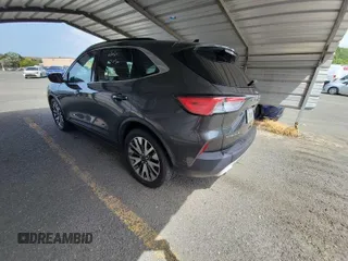 2020 Ford Escape Titanium Hybrid with VIN 1FMCU0DZ2LUB82013, listed as a IAAI auction lot 42727391 with 92,623 mi miles and . Bid and sale history available at DreamBid. Image 5.