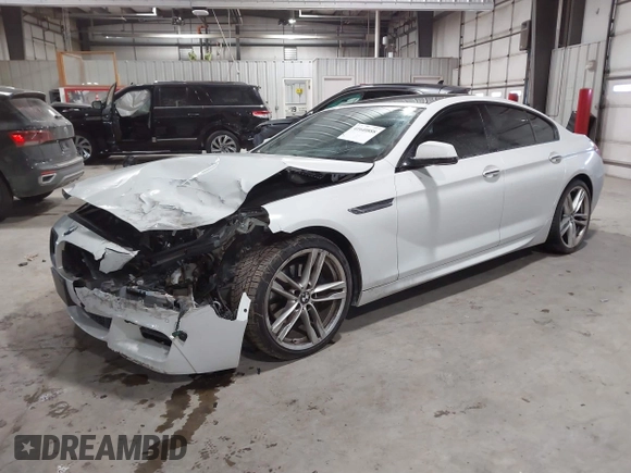 2014 BMW 6 Series 650i xDrive z VIN WBA6B4C55ED371378, wystawiony jako IAAI lot #41640888 z przebiegiem 80 927 mil mil oraz . Historia ofert i sprzedaży dostępna na DreamBid. Obrazek 17.
