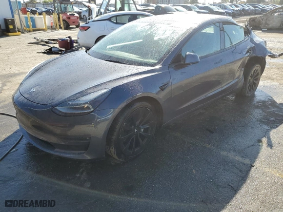 2022 Tesla Model 3 Long Range with VIN 5YJ3E1EB1NF125192, listed as a Copart auction lot 48877605 with 73,838 mi miles and Salvage Title. Bid and sale history available at carsss.com. Image 1.