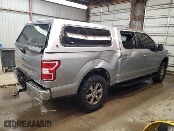 2020 Ford F-150 XL with VIN 1FTEW1E57LKF44499, listed as a Copart auction lot 60336735 with 156,745 mi miles and Salvage title. Bid and sale history available at DreamBid. Image 3.