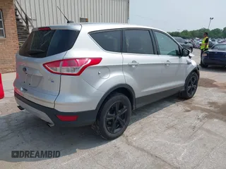 2014 Ford Escape SE with VIN 1FMCU9GX9EUD83148, listed as a IAAI auction lot 42449815 with 120,062 mi miles and . Bid and sale history available at DreamBid. Image 4.
