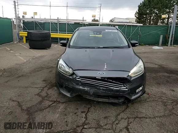 2016 Ford Focus Titanium z VIN 1FADP3N27GL329026, wystawiony jako Copart lot #60910475 z przebiegiem 98 794 mil mil oraz Szkoda całkowita • Salvage title. Historia ofert i sprzedaży dostępna na DreamBid. Obrazek 13.