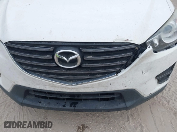 2016 Mazda CX-5 Sport with VIN JM3KE2BY1G0875484, listed as a IAAI auction lot 41838122 with 166,986 mi miles. Bid and sale history available at carsss.com. Image 17.