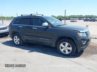2014 Jeep Grand Cherokee Laredo with VIN 1C4RJEAG9EC157383, listed as a IAAI auction lot 42074411 with 213,566 mi miles and . Bid and sale history available at DreamBid. Image 13.